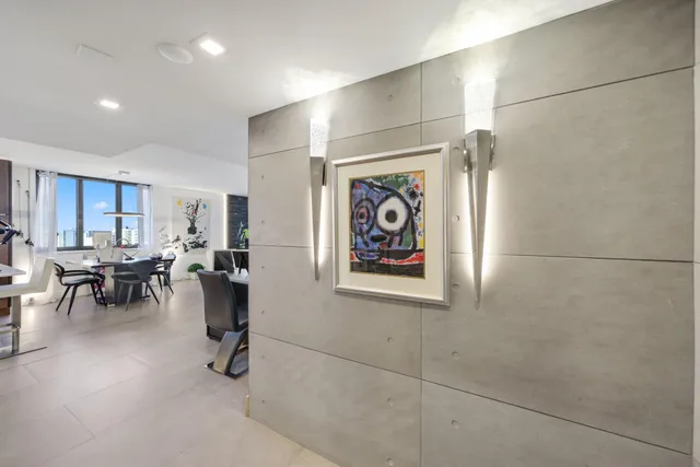 a kitchen with stainless steel appliances a sink stove and cabinets