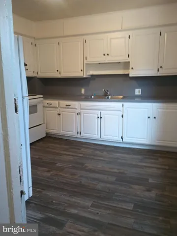 a view of cabinets and wooden floor