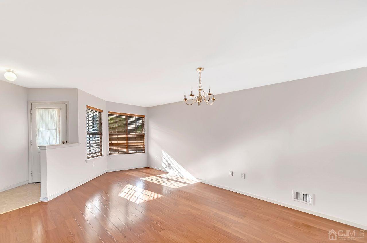 306 Hawthorne Road North Brunswick, NJ 08902 - Photo 4 of 34 an empty room with windows