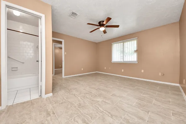 a view of an empty room with a window