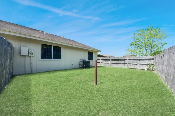 a backyard of a house with lots of green space