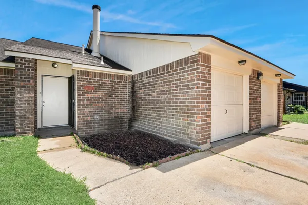 a front view of a house with garage