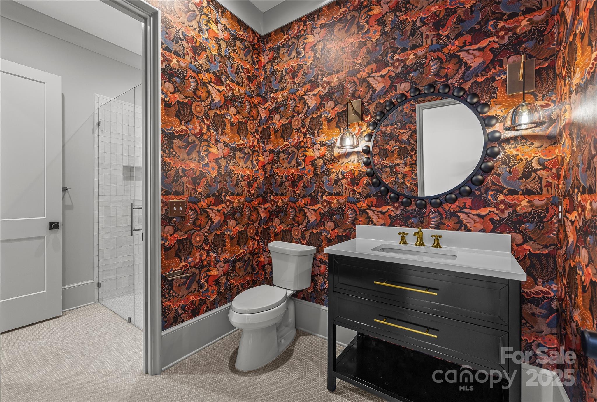 1233 Reece Road Charlotte, NC 28209 - Photo 15 of 48 a bathroom with a toilet sink and mirror