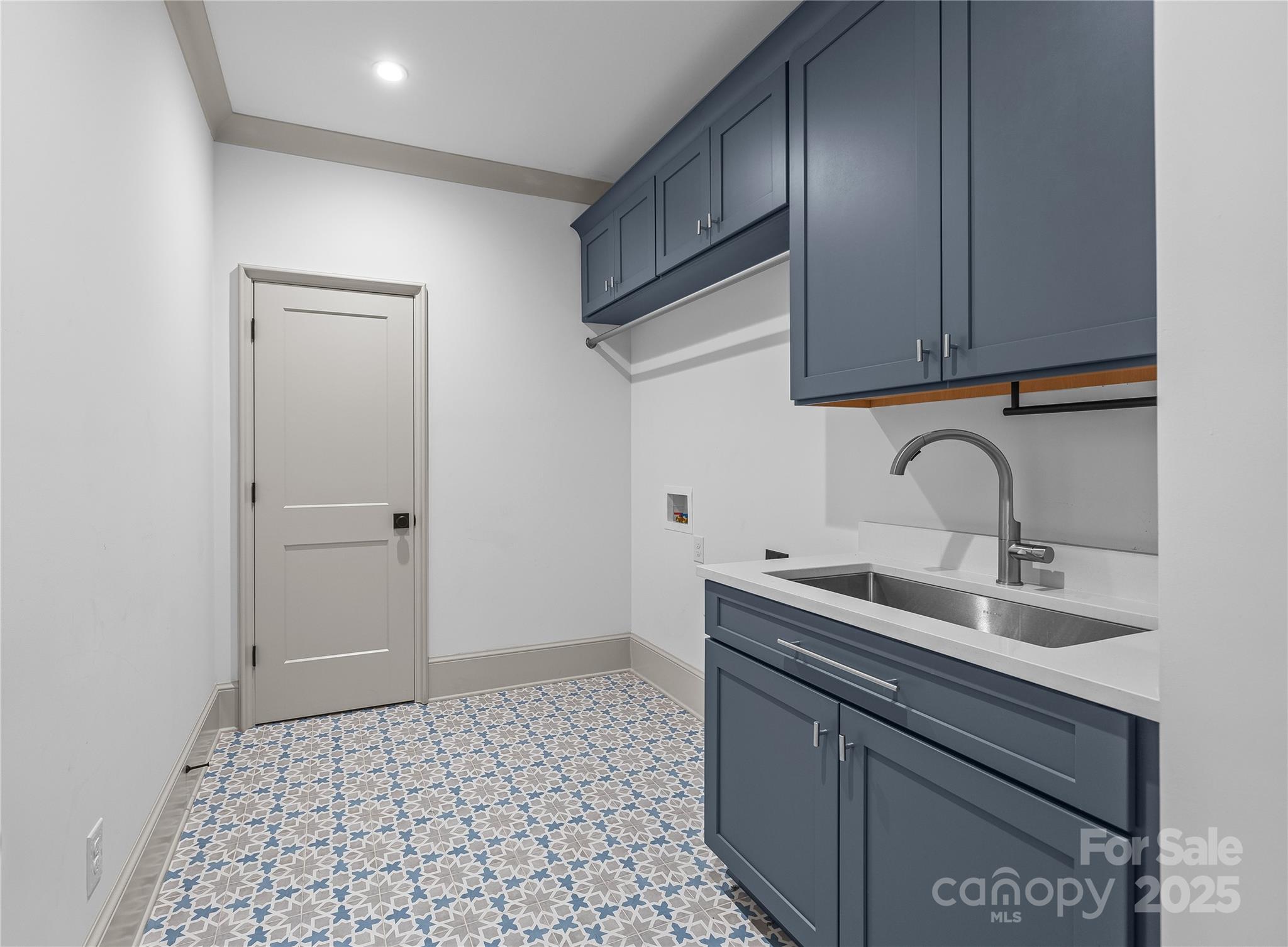 1233 Reece Road Charlotte, NC 28209 - Photo 24 of 48 a kitchen with a sink and cabinets