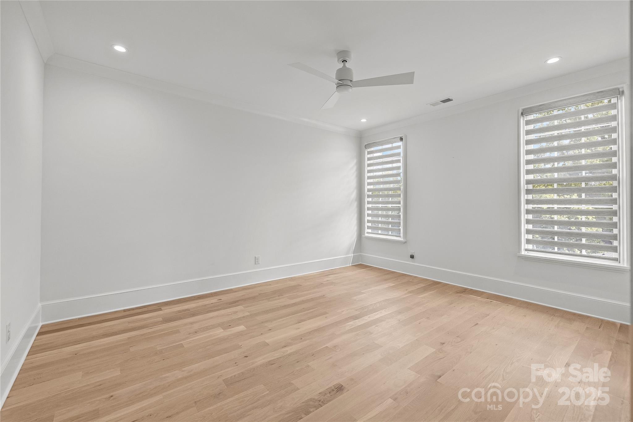 1233 Reece Road Charlotte, NC 28209 - Photo 25 of 48 wooden floor in an empty room with a window