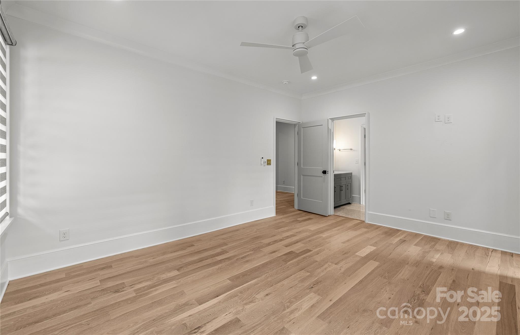 1233 Reece Road Charlotte, NC 28209 - Photo 31 of 48 an empty room with wooden floor and windows