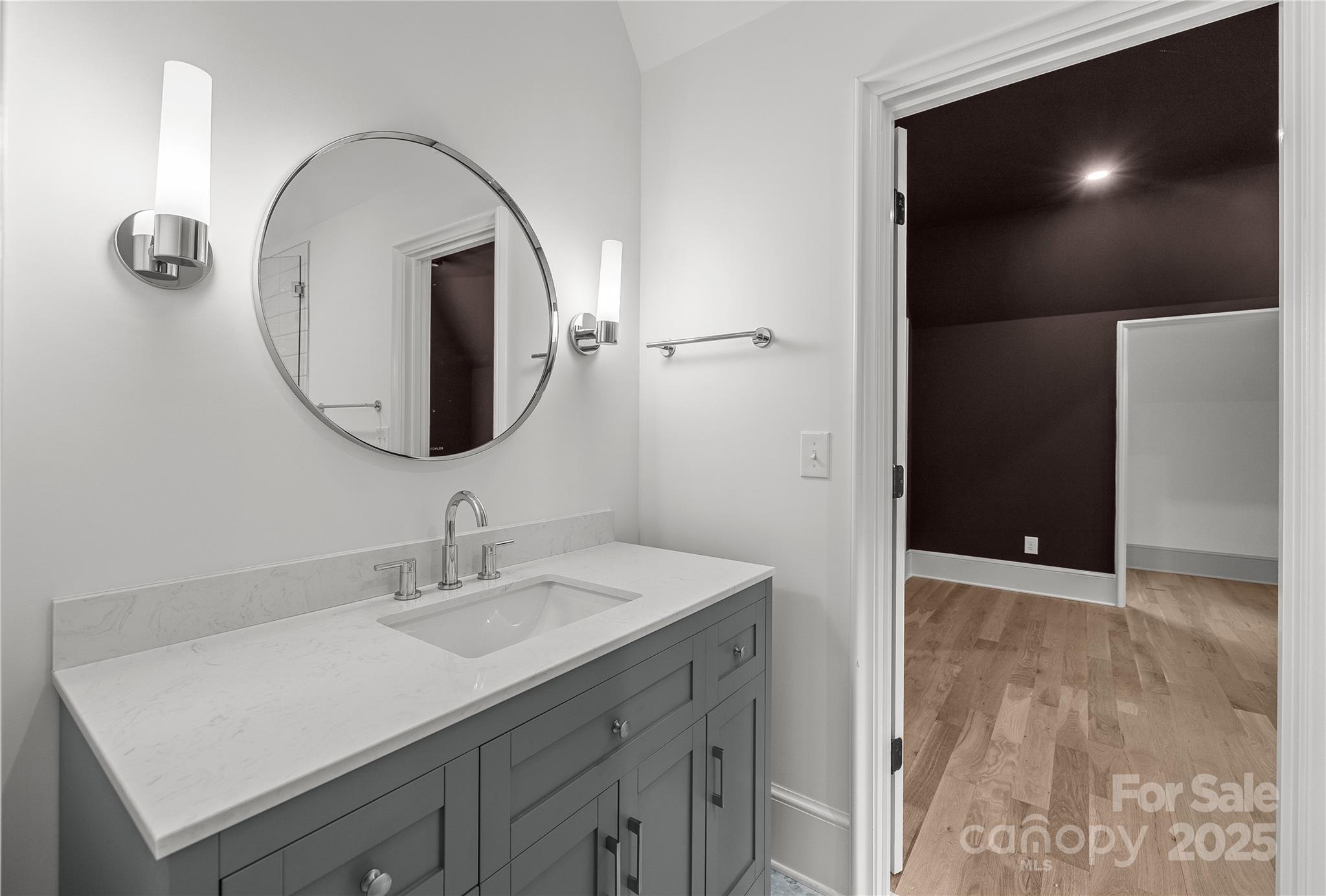 1233 Reece Road Charlotte, NC 28209 - Photo 33 of 48 a bathroom with a sink and a mirror