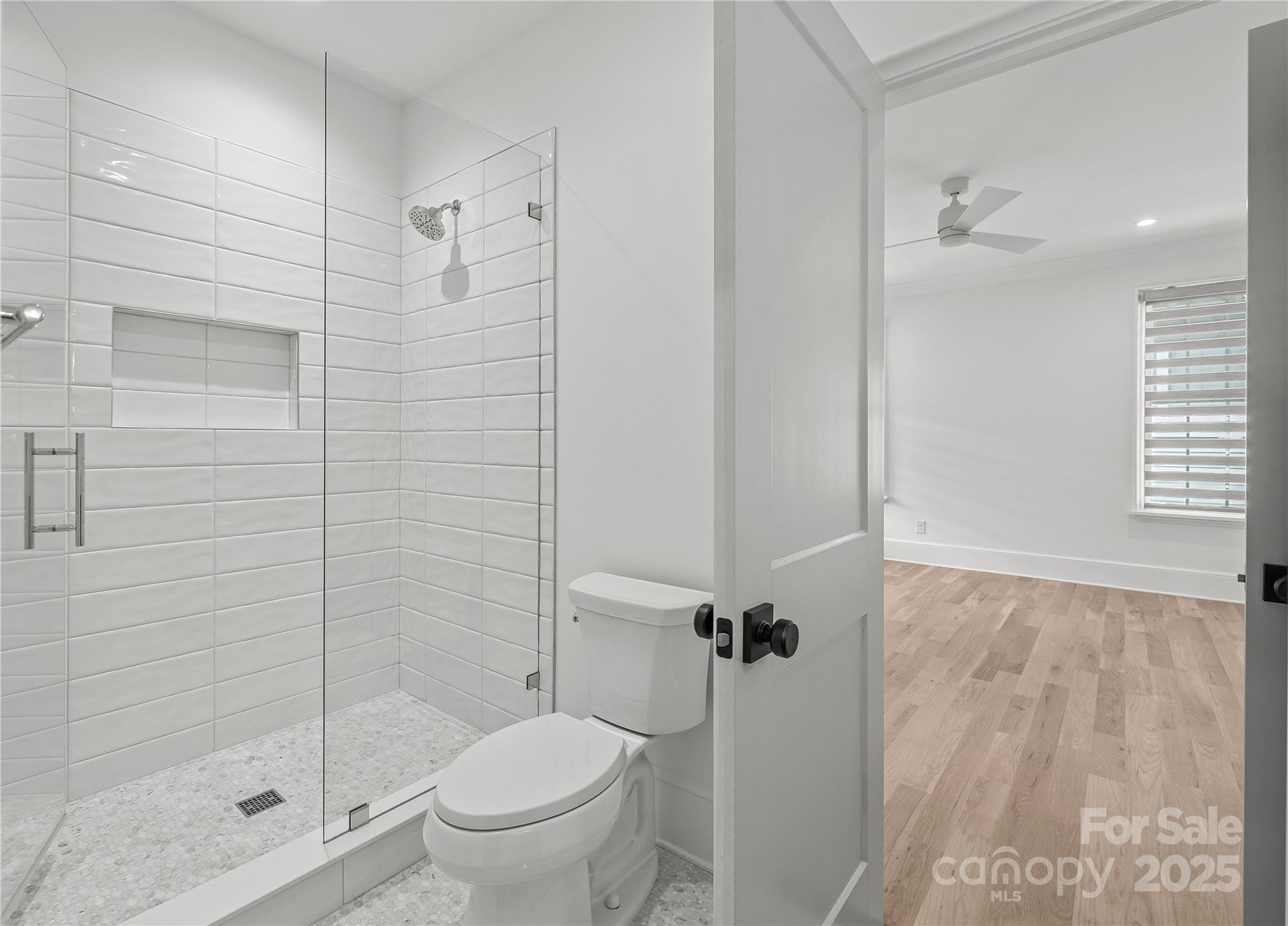 1233 Reece Road Charlotte, NC 28209 - Photo 34 of 48 a bathroom with a shower and a toilet