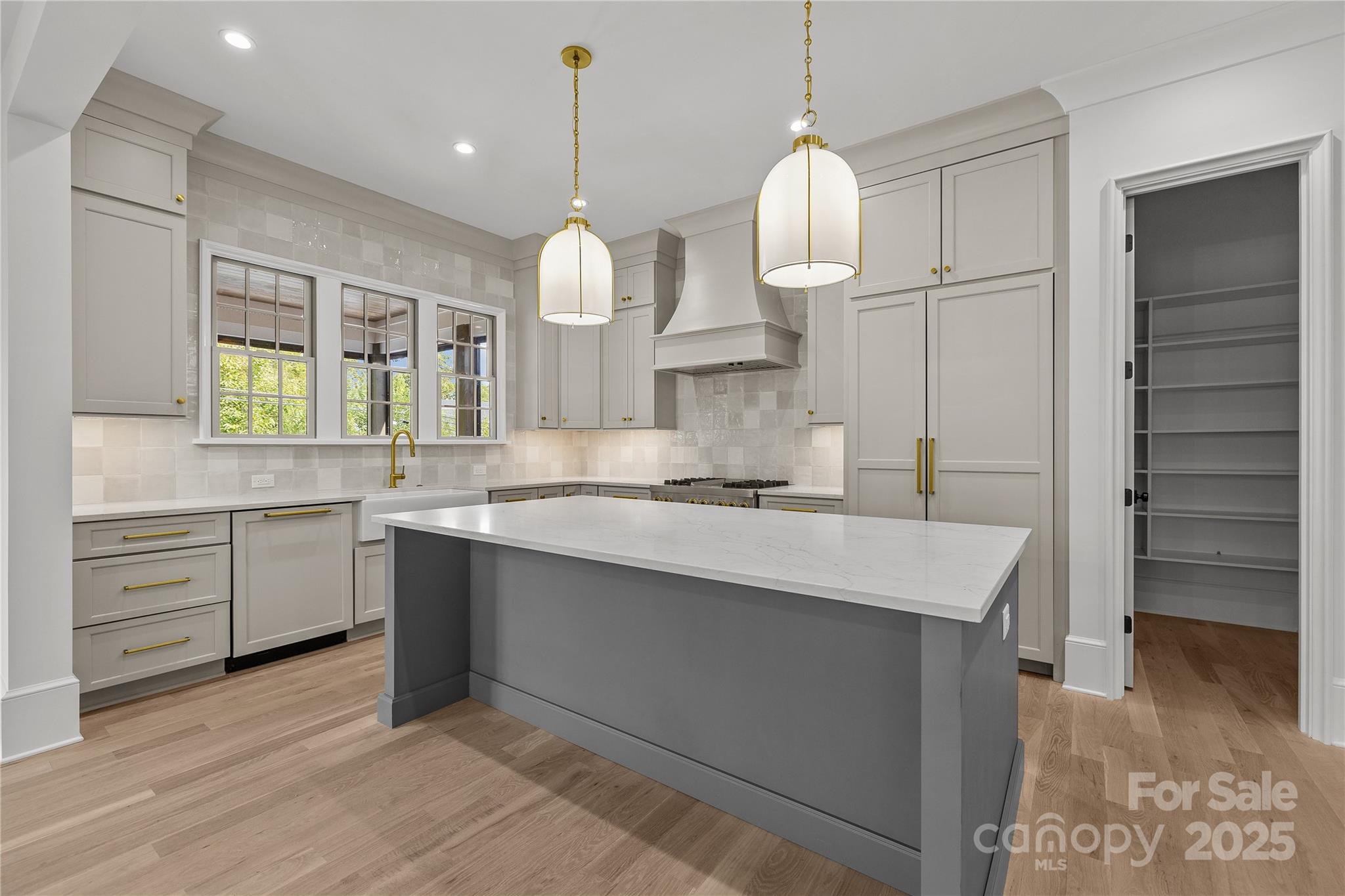 1233 Reece Road Charlotte, NC 28209 - Photo 8 of 48 a large kitchen with cabinets