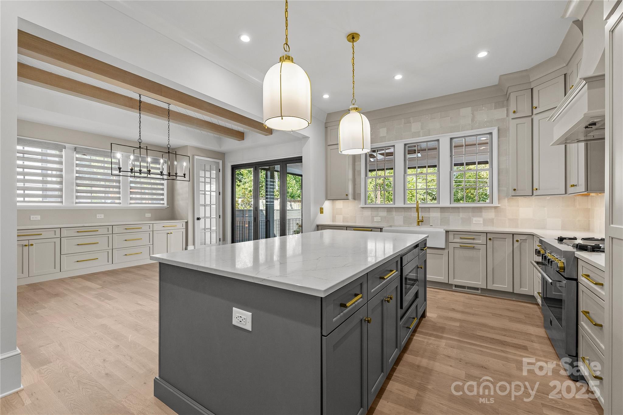 1233 Reece Road Charlotte, NC 28209 - Photo 10 of 48 a kitchen with counter top space a sink appliances and cabinets
