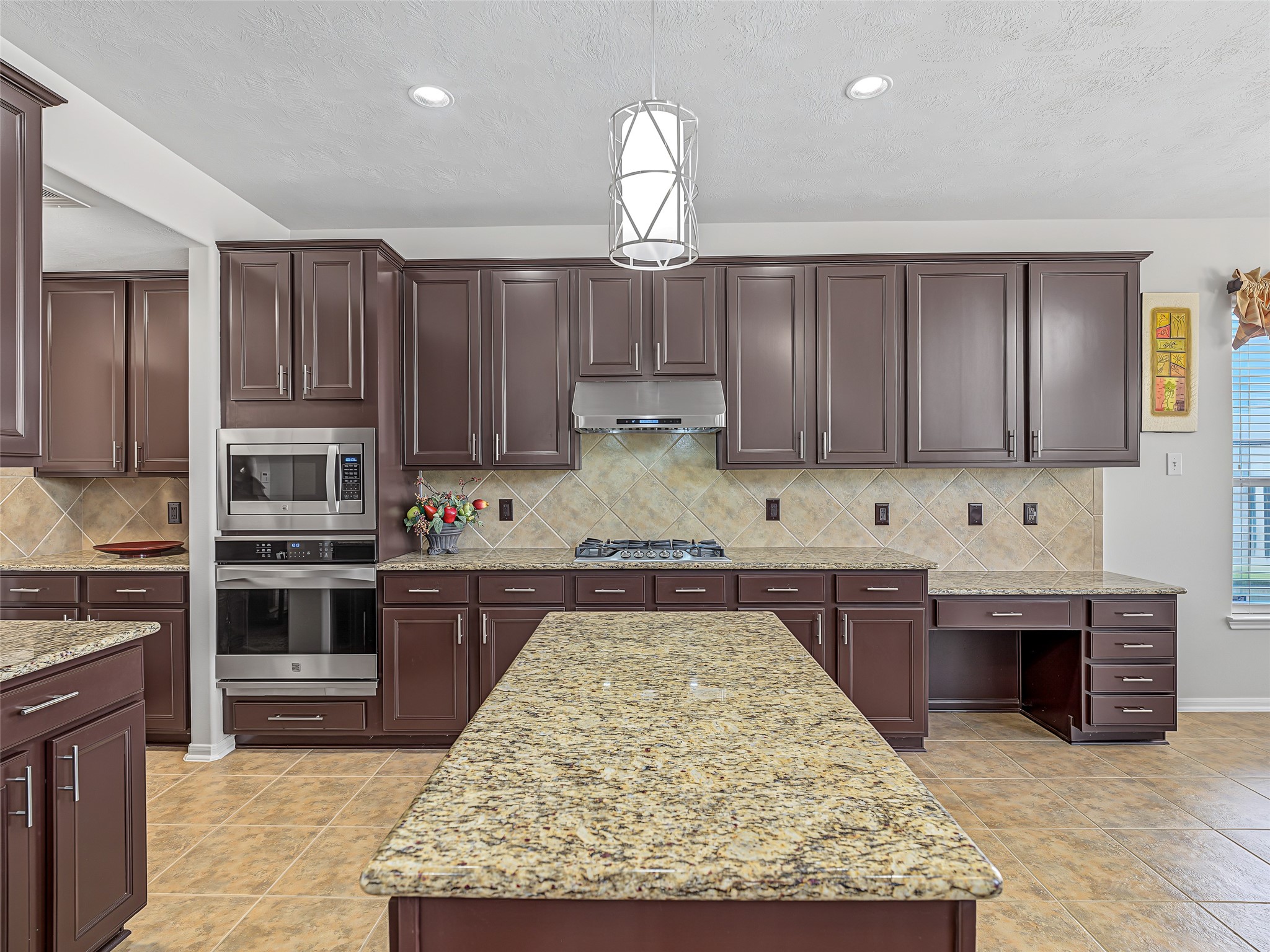2210 Fox Path Katy, TX 77494 - Photo 21 of 47 This highly functional kitchen alcove maximizes both storage and utility, creating the perfect secondary workspace tucked right off the main culinary line.