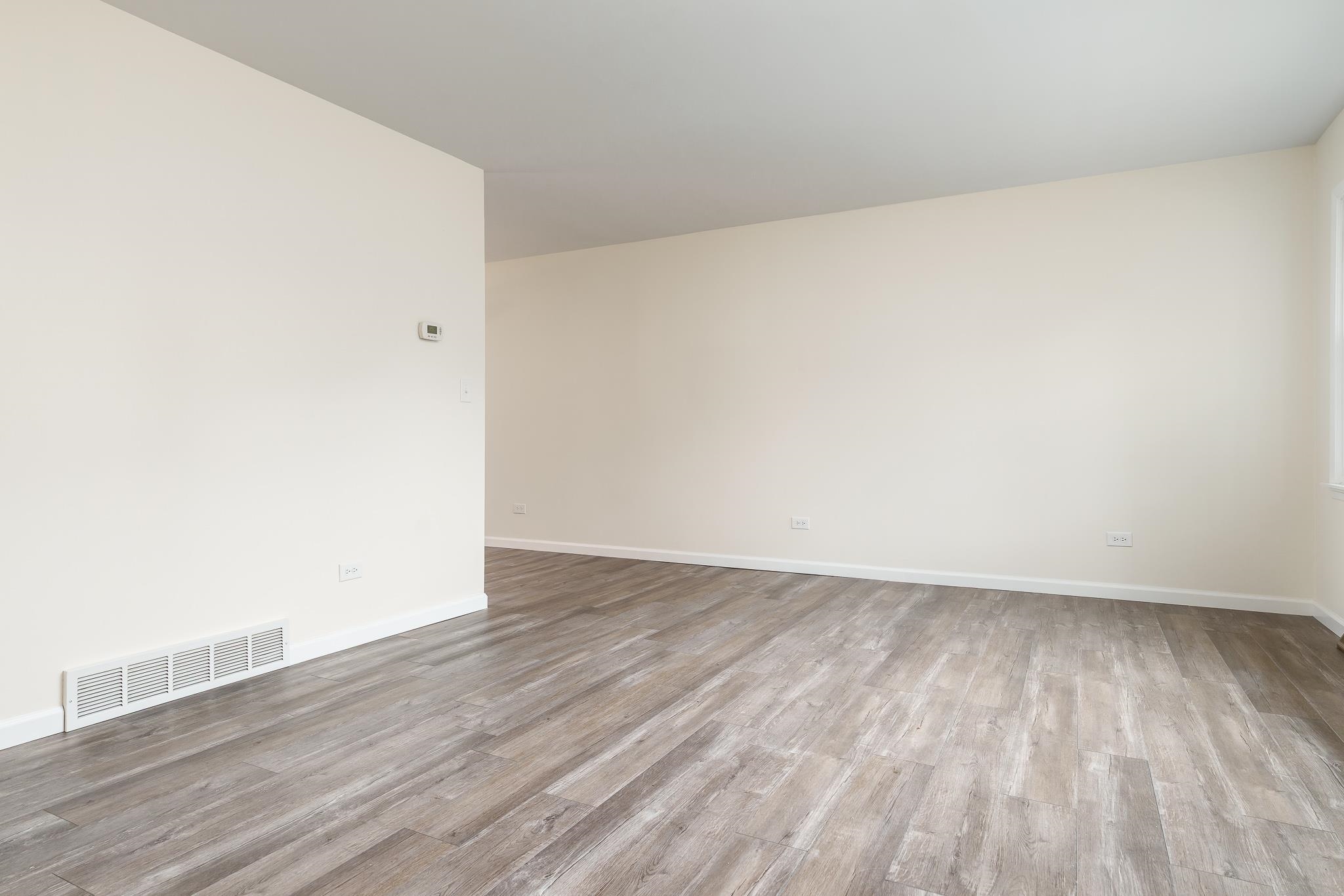 338 Northway Park Road, Unit 6 Machesney Park, IL 61115 - Photo 11 of 38 an empty room with wooden floor