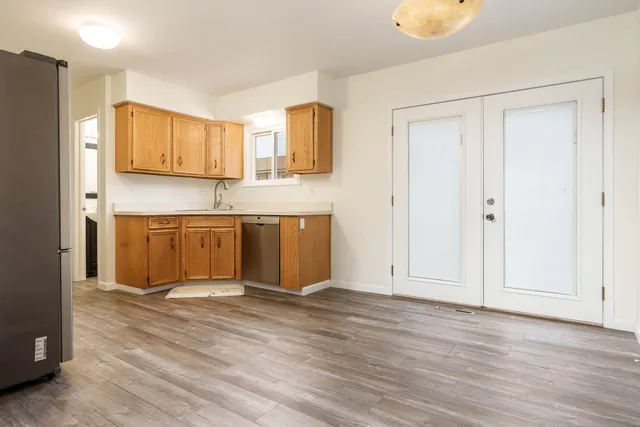 a view of kitchen with wooden floor and window