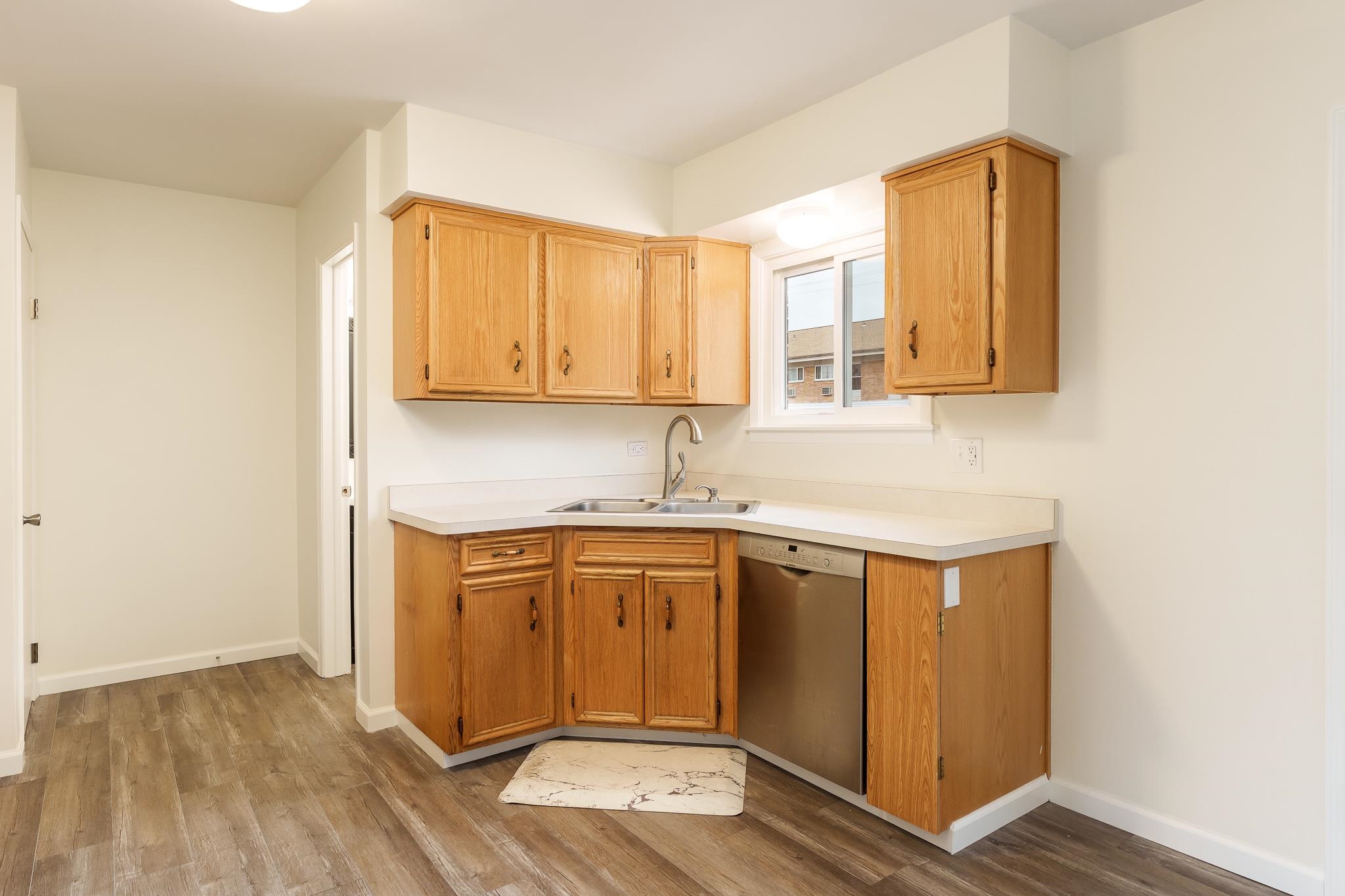 338 Northway Park Road, Unit 6 Machesney Park, IL 61115 - Photo 17 of 38 a kitchen with stainless steel appliances granite countertop a sink and wooden cabinets