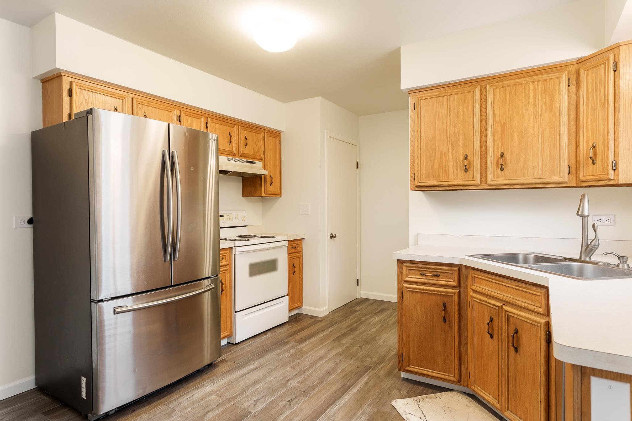 338 Northway Park Road, Unit 6 Machesney Park, IL 61115 - Photo 18 of 38 a kitchen with stainless steel appliances a refrigerator sink and microwave