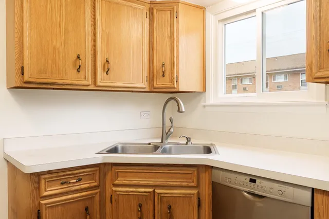 a kitchen with a sink and cabinets