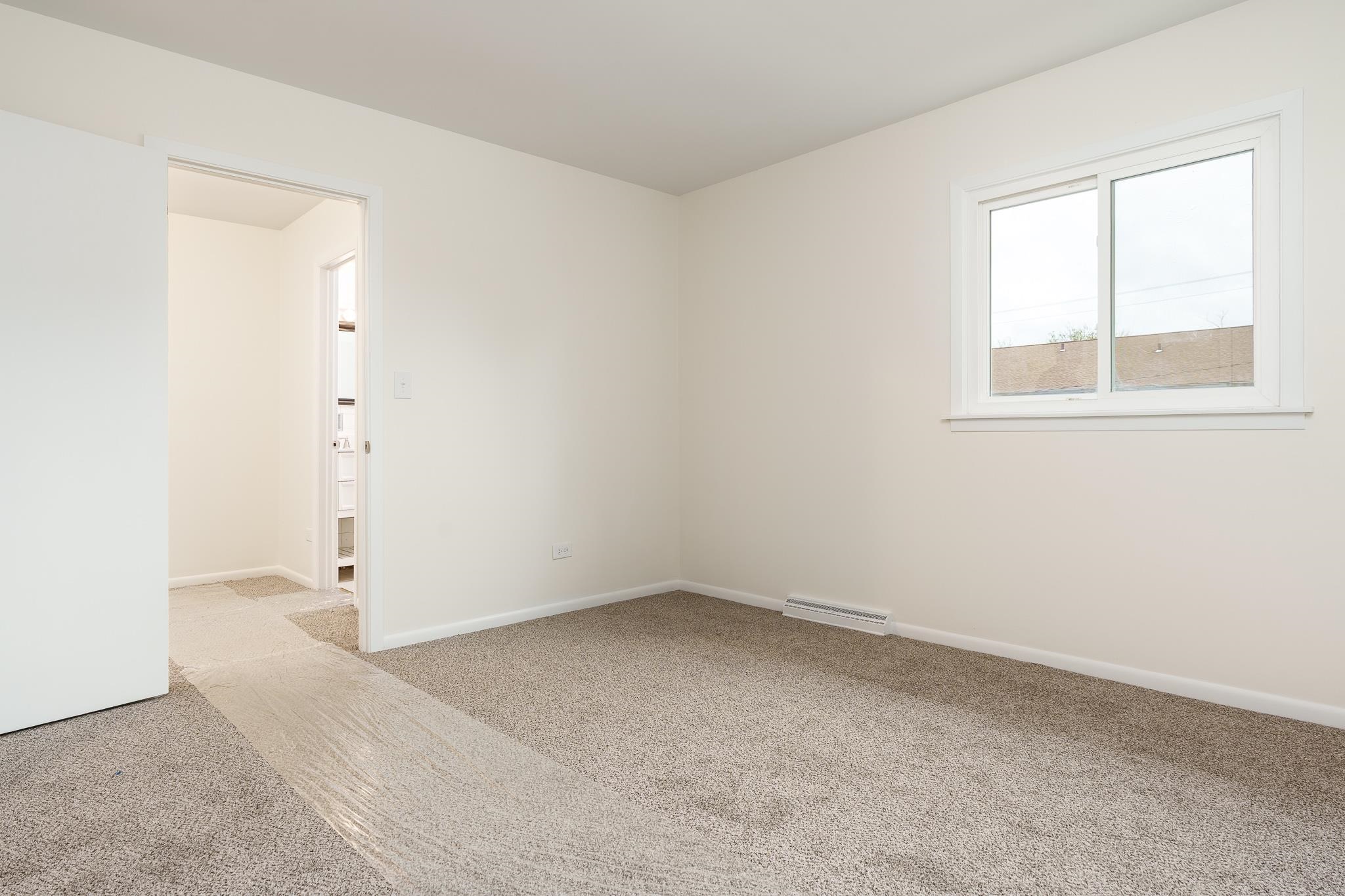 338 Northway Park Road, Unit 6 Machesney Park, IL 61115 - Photo 28 of 38 an empty room with a window