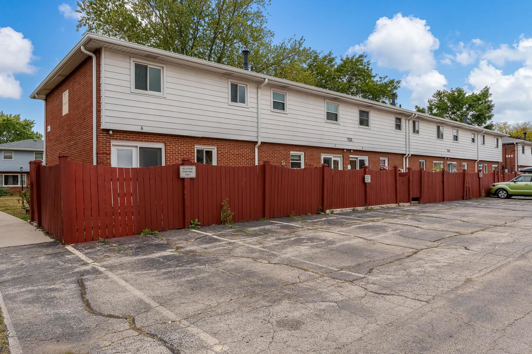 338 Northway Park Road, Unit 6 Machesney Park, IL 61115 - Photo 6 of 38 a view of an house with backyard space and wooden fence