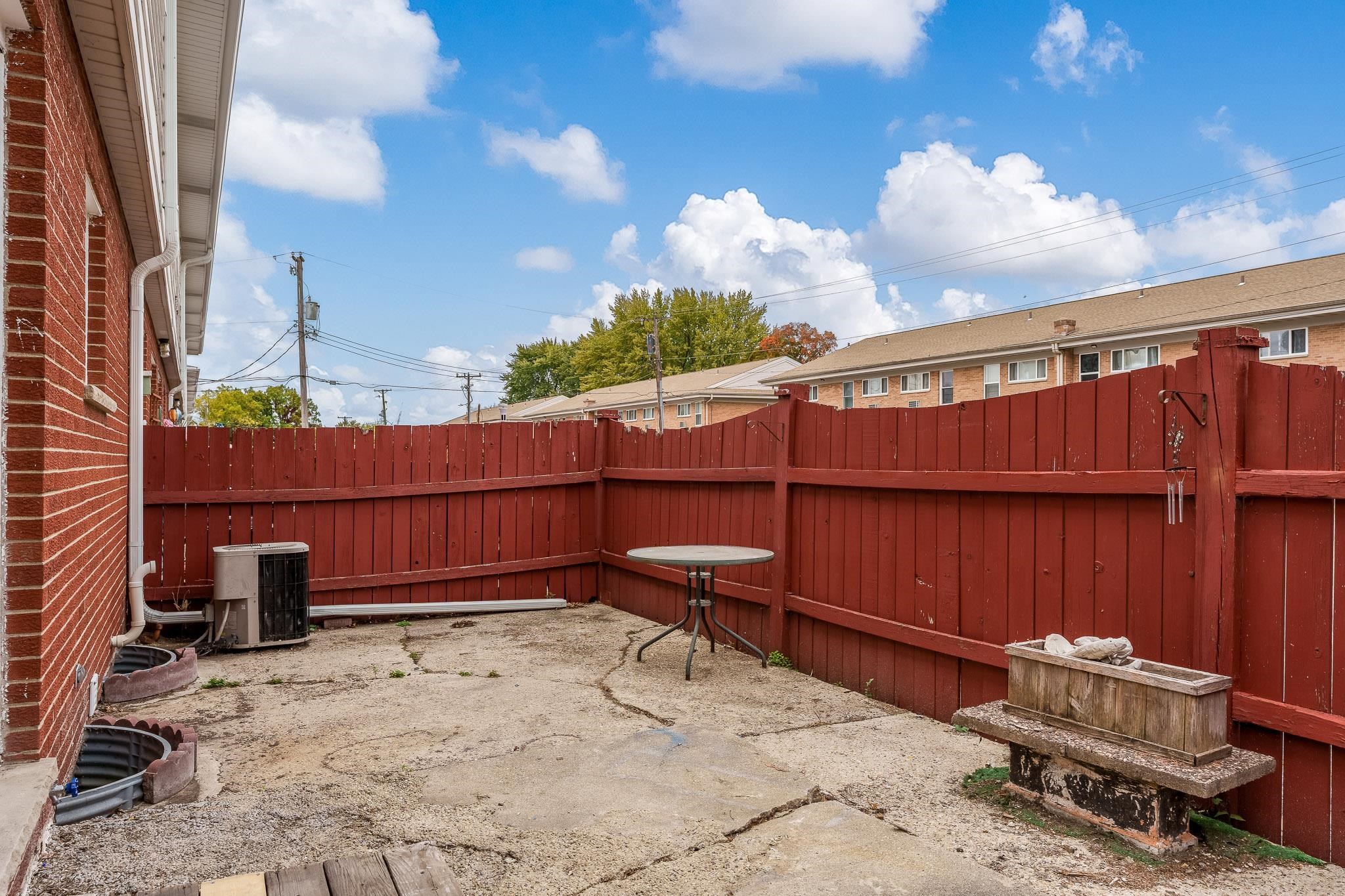 338 Northway Park Road, Unit 6 Machesney Park, IL 61115 - Photo 8 of 38 a view of a backyard with a chair