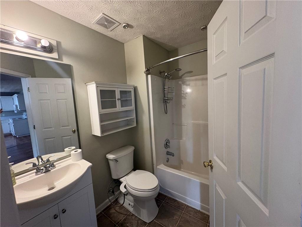 298 Little Street White, GA 30184 - Photo 11 of 23 a bathroom with a sink a toilet and shower