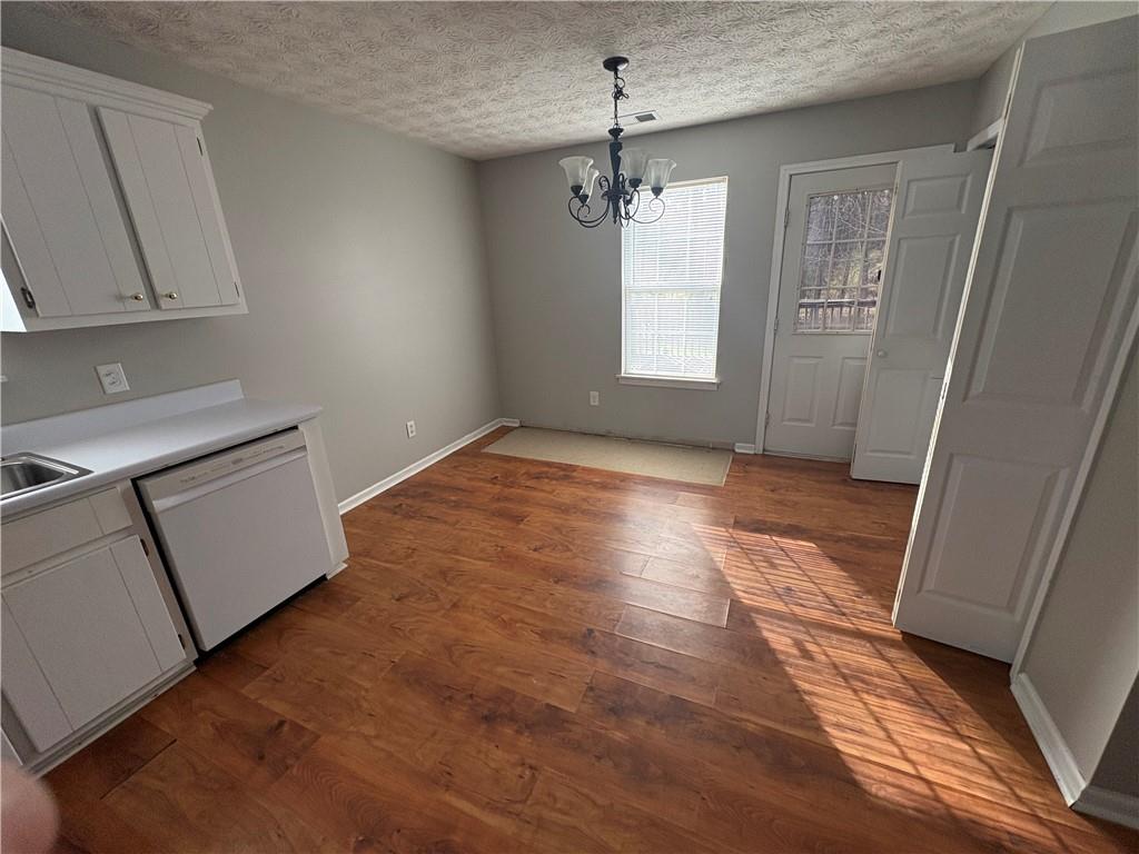 298 Little Street White, GA 30184 - Photo 8 of 23 a view of empty room with wooden floor and fan