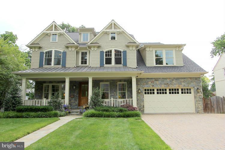 8007 Custer Road Bethesda, MD 20814 - Photo 1 of 25 a front view of white house with a yard
