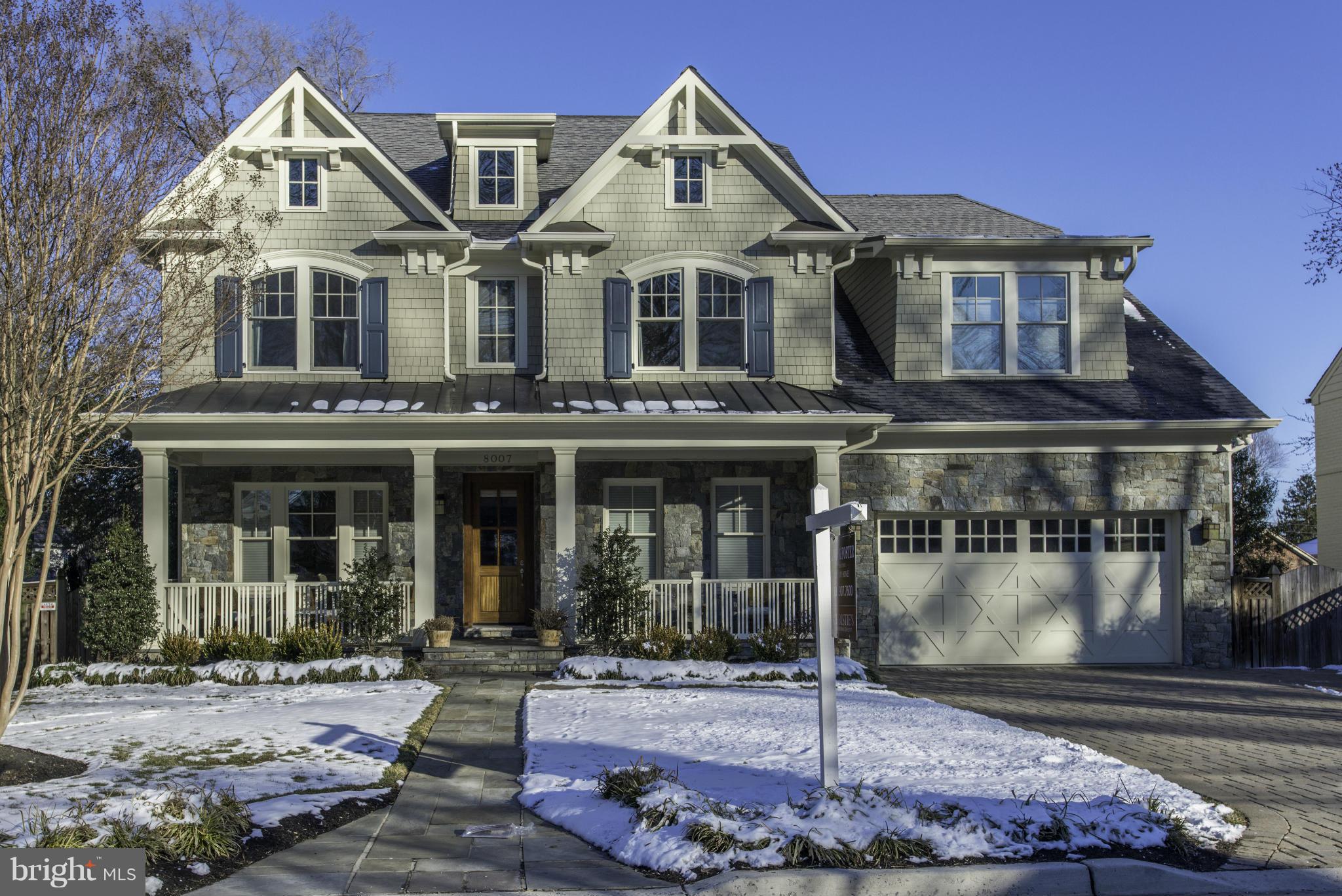 8007 Custer Road Bethesda, MD 20814 - Photo 2 of 25 a front view of a house with a yard