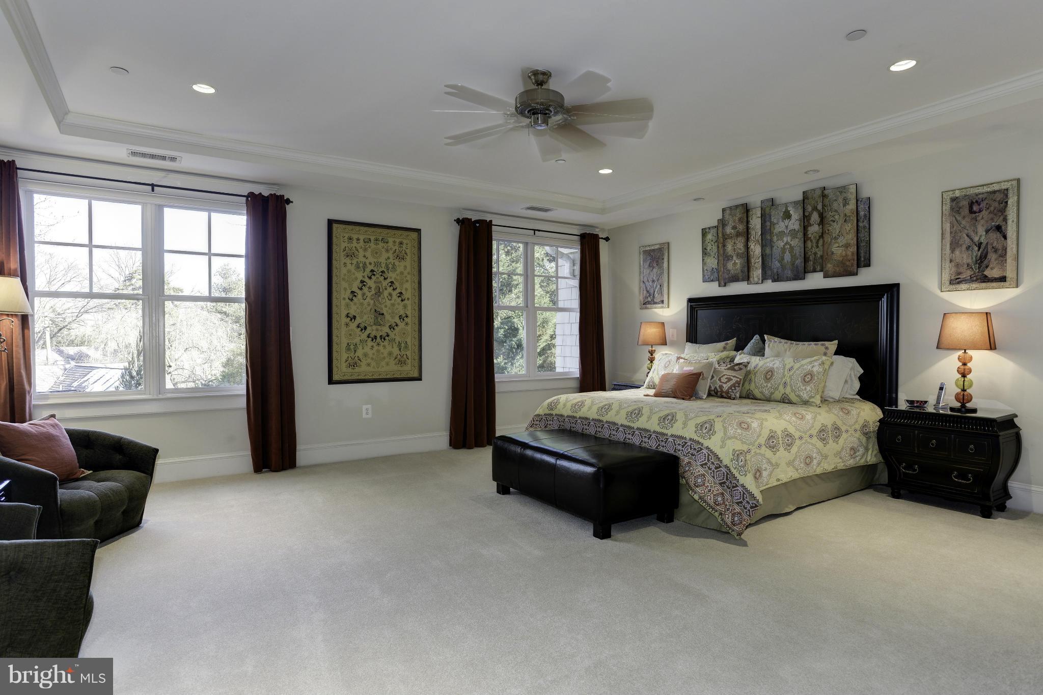 8007 Custer Road Bethesda, MD 20814 - Photo 11 of 25 a spacious bedroom with a bed and glass window