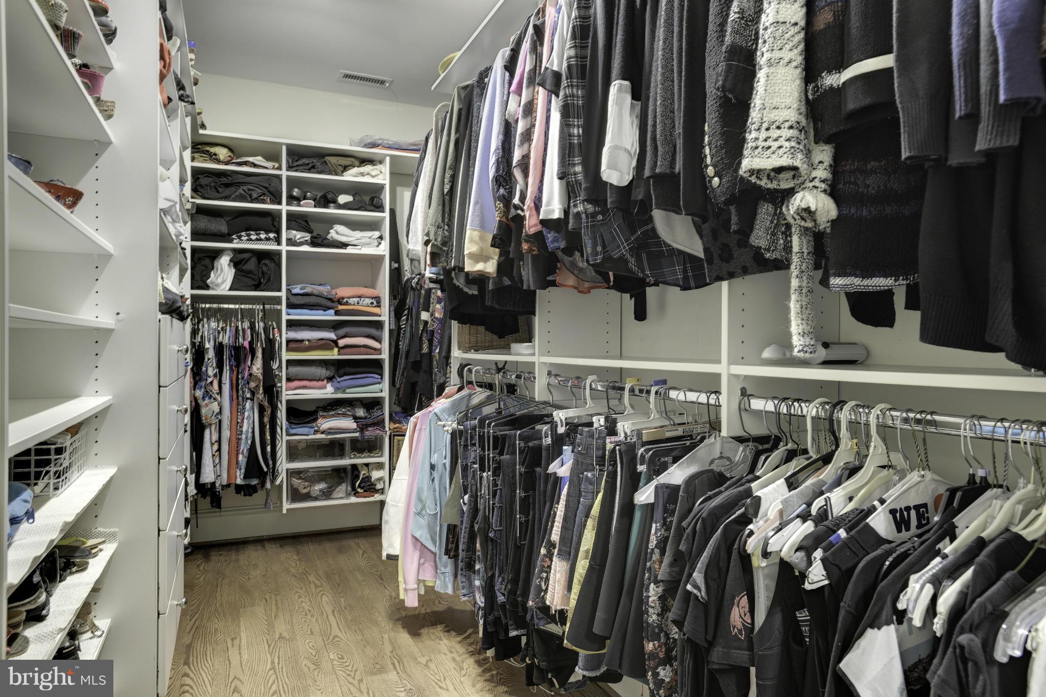 8007 Custer Road Bethesda, MD 20814 - Photo 14 of 25 a view of walk in closet with clothes and shoes