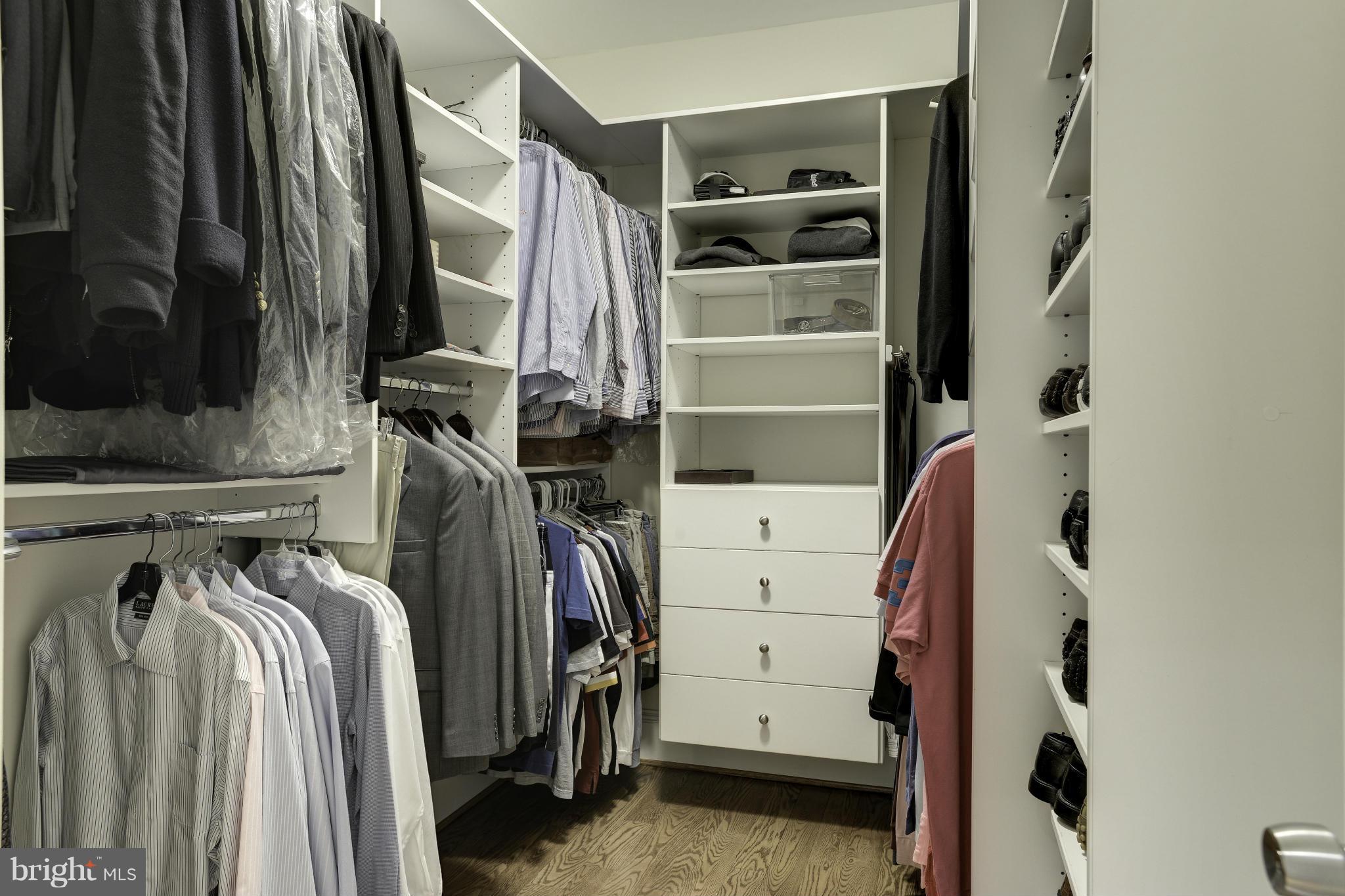 8007 Custer Road Bethesda, MD 20814 - Photo 15 of 25 a view of walk in closet with clothes and shoes