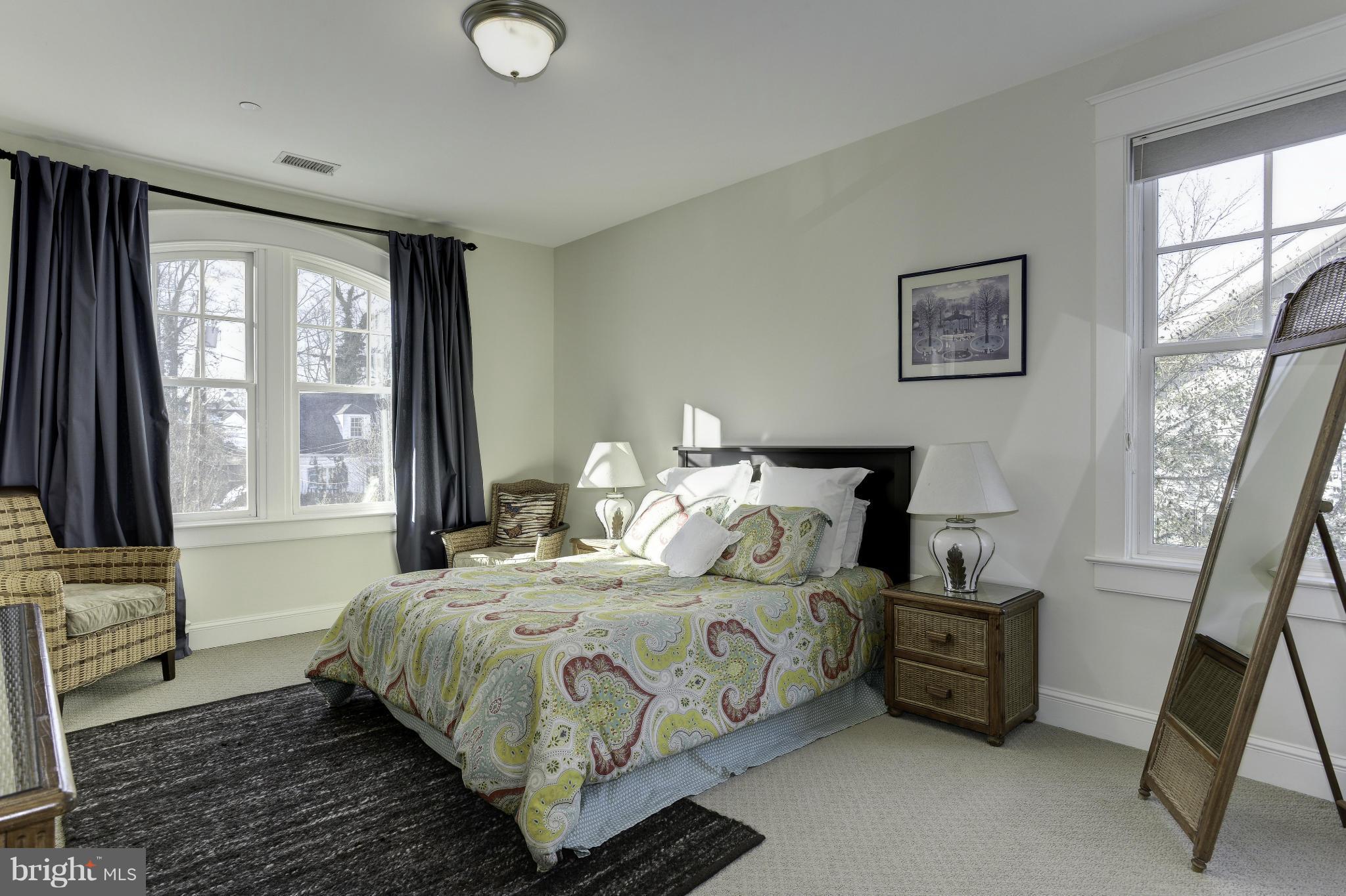 8007 Custer Road Bethesda, MD 20814 - Photo 16 of 25 a bedroom with a bed and a window