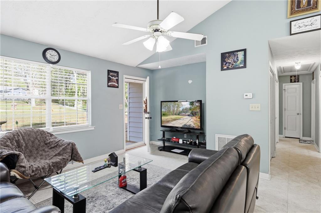 211 Brooks Lane Winder, GA 30680 - Photo 11 of 27 a living room with furniture and a flat screen tv