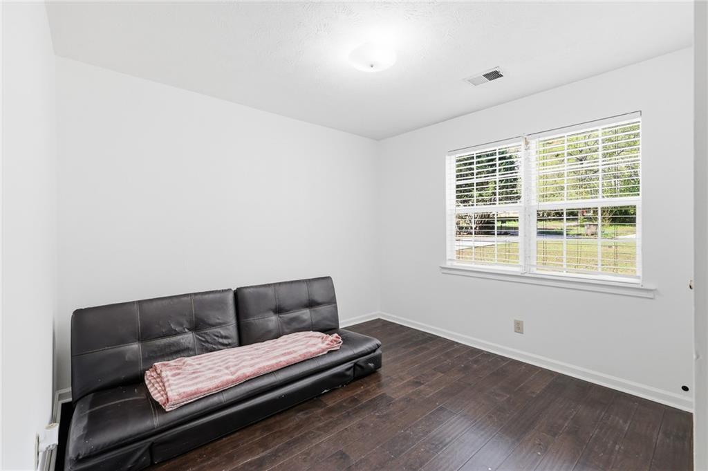 211 Brooks Lane Winder, GA 30680 - Photo 20 of 27 a living room with furniture and a window