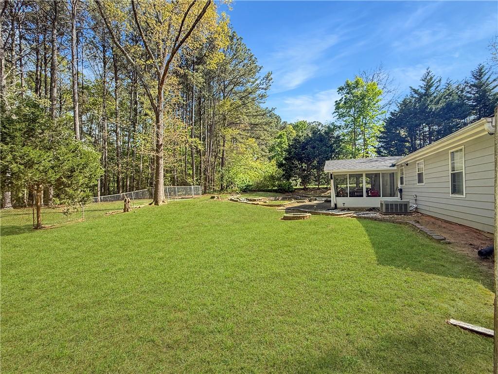 211 Brooks Lane Winder, GA 30680 - Photo 24 of 27 a view of a house with a big yard