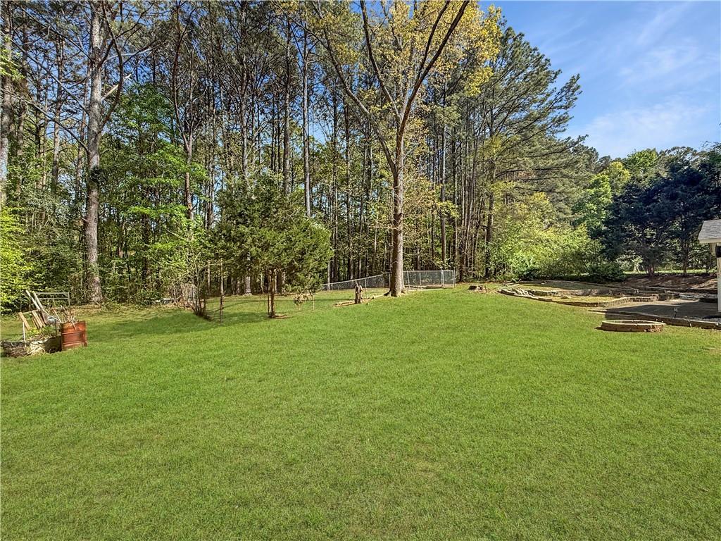 211 Brooks Lane Winder, GA 30680 - Photo 25 of 27 a view of a park with large trees