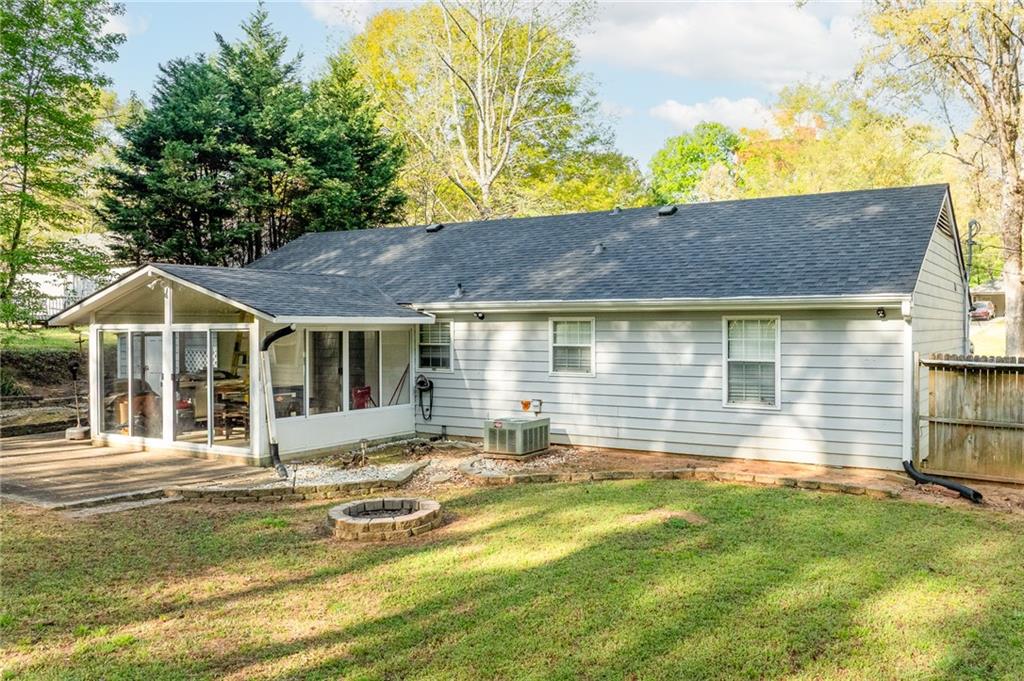 211 Brooks Lane Winder, GA 30680 - Photo 26 of 27 a front view of a house with a yard