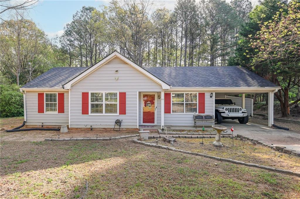 211 Brooks Lane Winder, GA 30680 - Photo 3 of 27 a front view of a house with a yard and outdoor seating