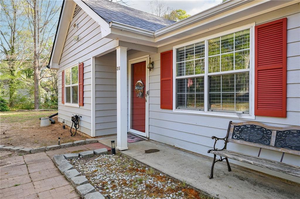 211 Brooks Lane Winder, GA 30680 - Photo 8 of 27 a front view of a house with garden