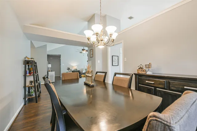 a spacious bedroom with a bed and a tv