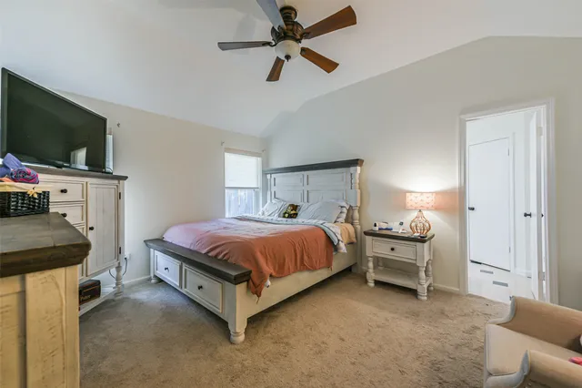 a bedroom with a bed and a dresser