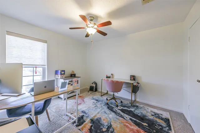 a work room with furniture and windows