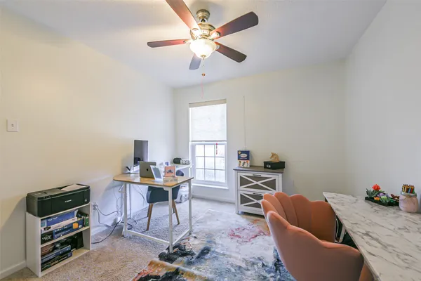 a workspace with furniture and a window