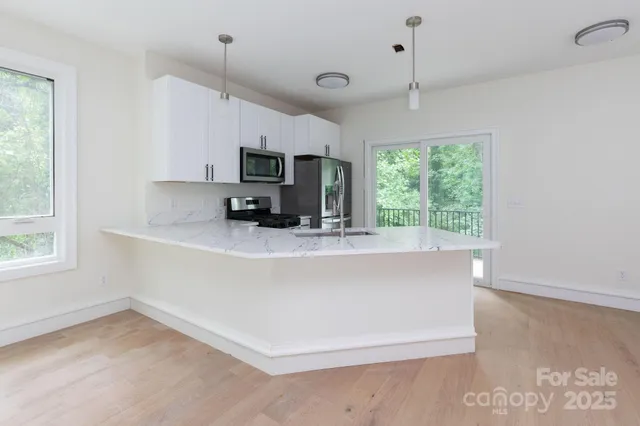 a view of kitchen with window and furniture
