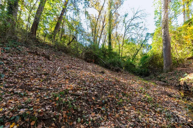 an aerial view of residential building with outdoor space and lake view