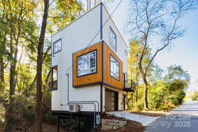 a view of a house with a iron stairs