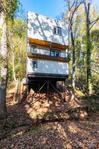 a view of a chairs and table in the backyard