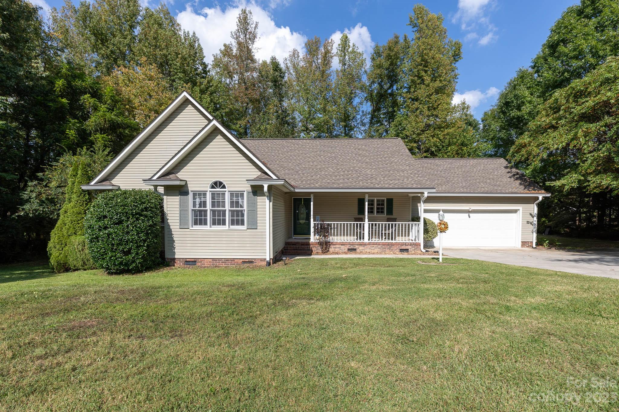 1598 Glenway Road Clover, SC 29710 - Photo 1 of 36 a front view of a house with a garden