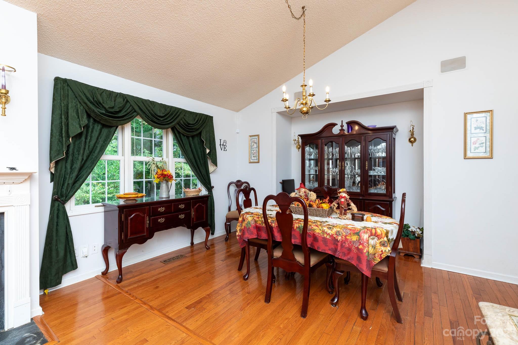 1598 Glenway Road Clover, SC 29710 - Photo 23 of 36 a view of a dining room with furniture window and wooden floor