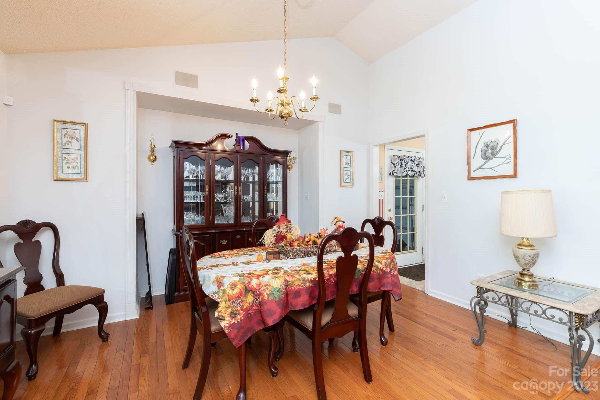 1598 Glenway Road Clover, SC 29710 - Photo 24 of 36 a view of a dining room with furniture wooden floor and chandelier