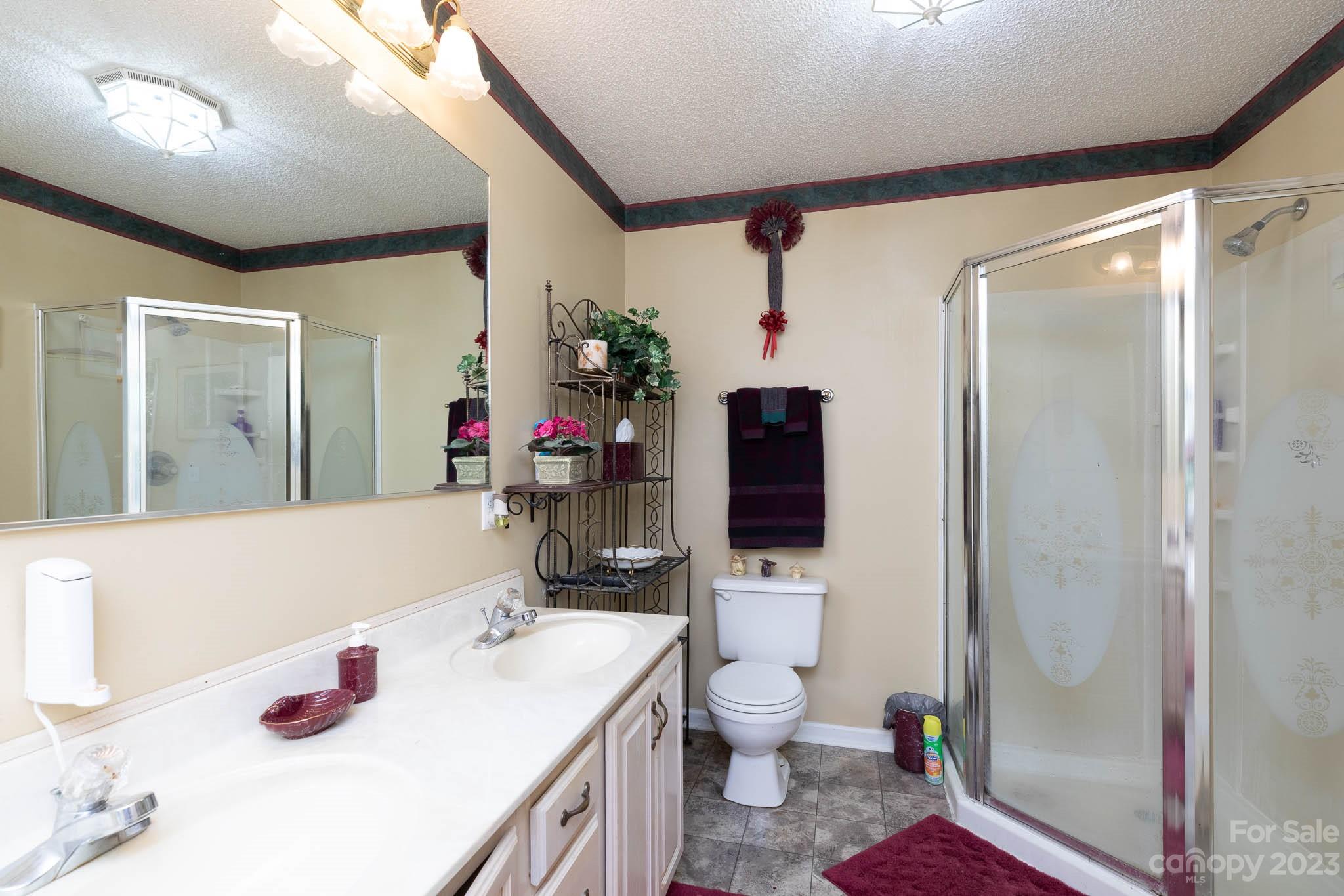 1598 Glenway Road Clover, SC 29710 - Photo 31 of 36 a bathroom with a sink toilet vanity and shower